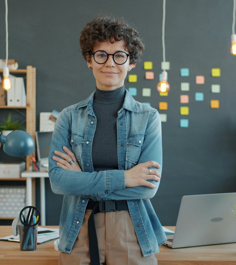 Teacher standing in a modern classroom, ready for an AI video interview